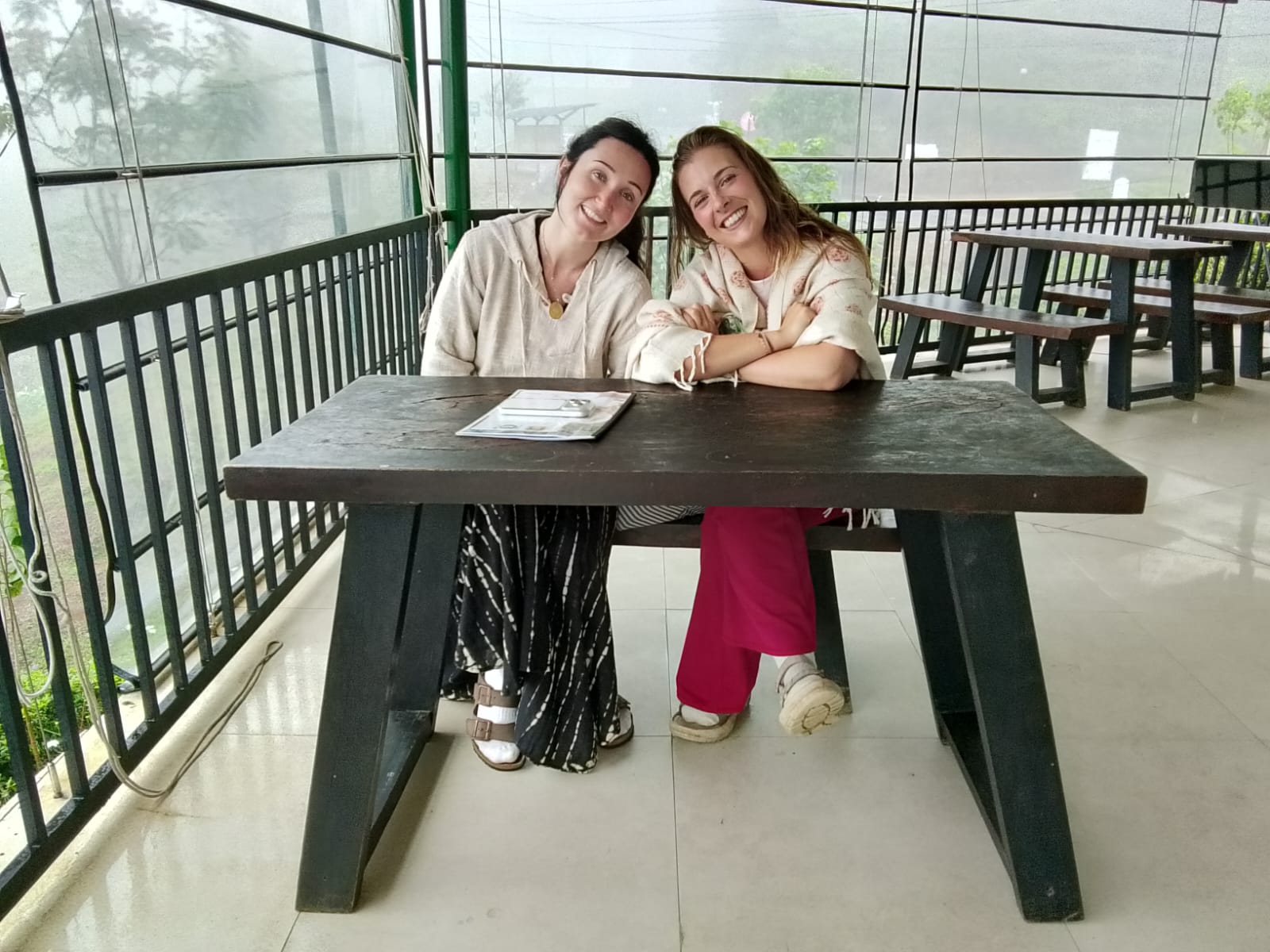 Travelers enjoying the misty hill country views